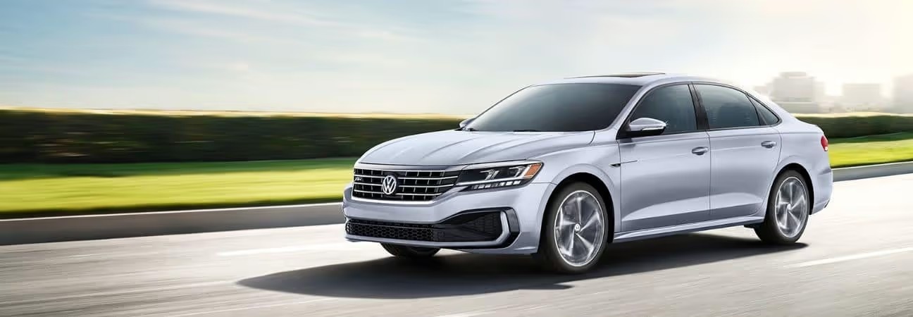 2020 Volkswagen Passat in silver driving outside a city